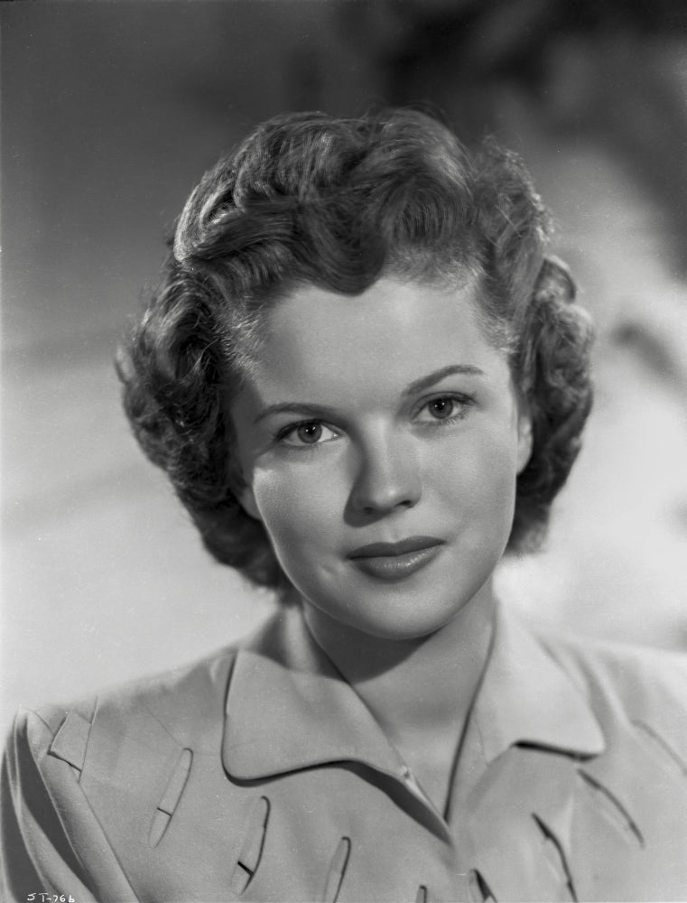 Close-up portrait photo print of Shirley Temple in a shirtdress.