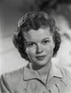 Close-up portrait photo print of Shirley Temple in a shirtdress.