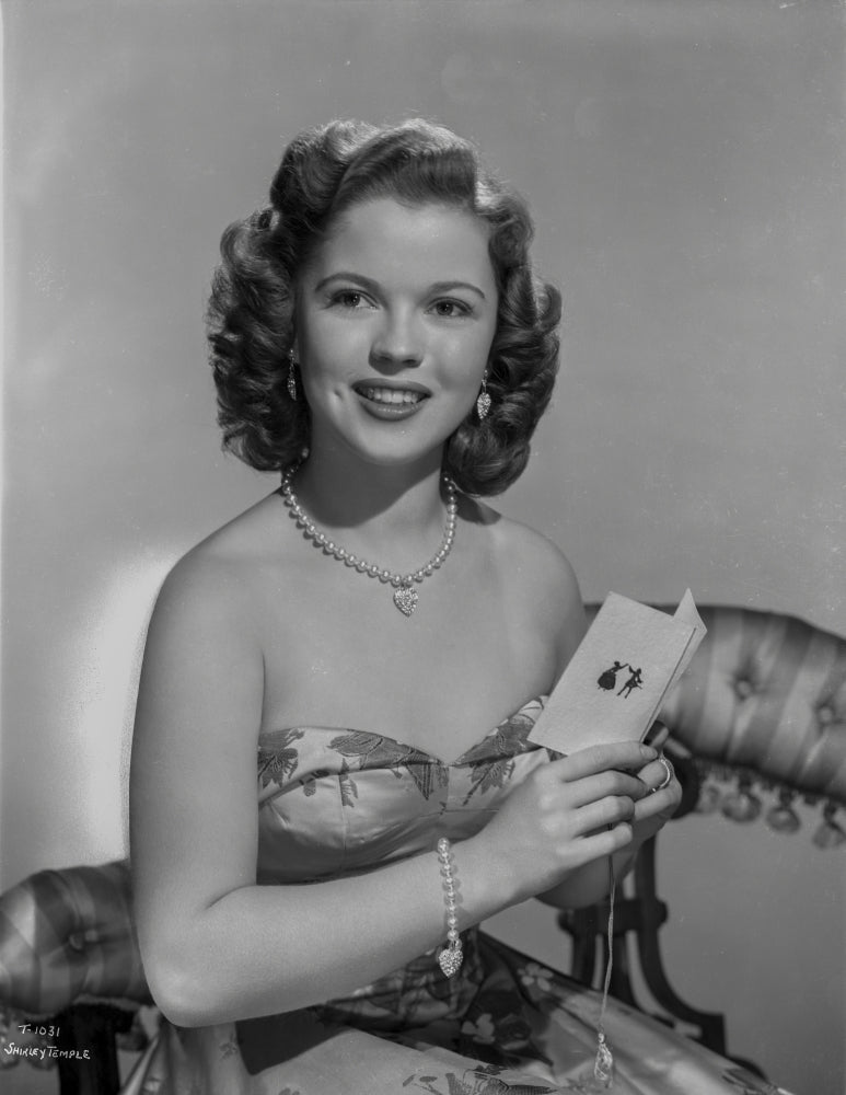 Shirley Temple posing in floral dress photo print.