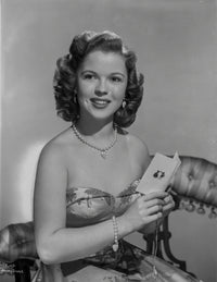Shirley Temple posing in floral dress photo print.