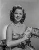 Shirley Temple posing in floral dress photo print.