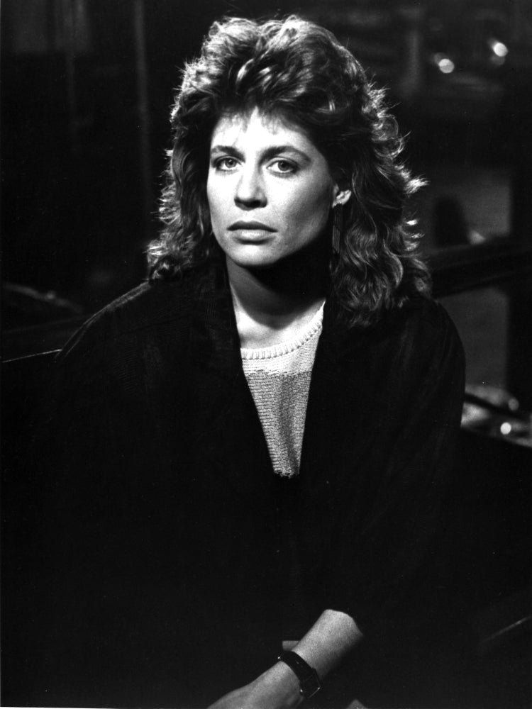 Linda Hamilton classic portrait photo print wearing a black coat.