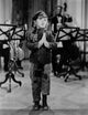 Shirley Temple praying in black coat photo print