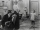 Shirley Temple talking with her parents in the living room photo print