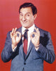 Danny Thomas posed in blue coat with red background photo print