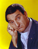 Danny Thomas photo print in black coat against yellow background.