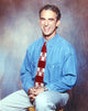 Jay Thomas Portrait Photo Print featuring actor seated in a chair.