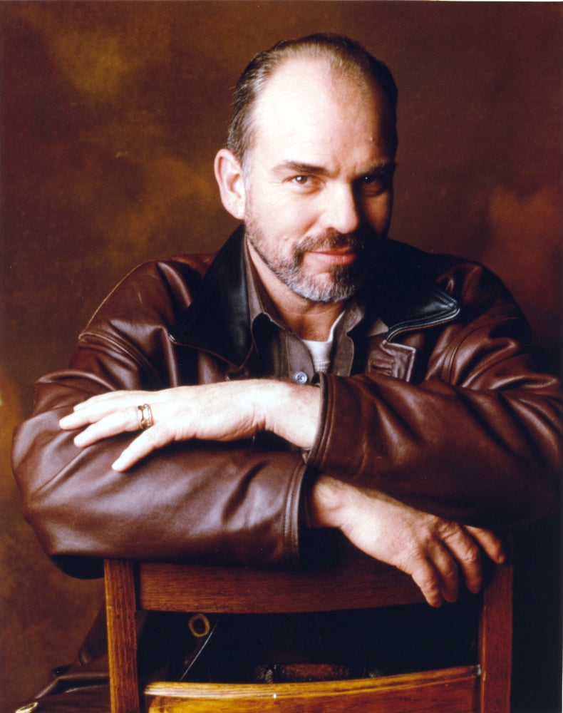 Billy Thornton leaning on a chair in brown leather jacket portrait photo print.