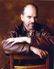 Billy Thornton leaning on a chair in brown leather jacket portrait photo print.
