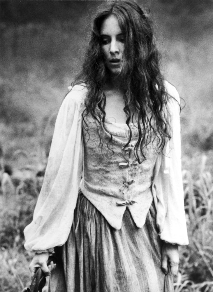 Madeleine Stowe classic portrait photo print in white long sleeve and vest.