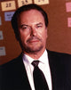 Rip Torn in black coat and black tie photo print
