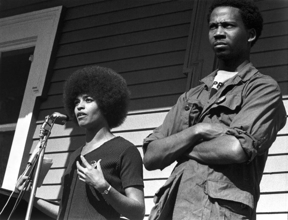 Candid photo print of Angela Davis speaking, available in various sizes.