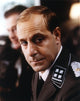 Stanley Tucci posed in black uniform photo print