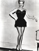 Lana Turner standing pose in elegant black gown photo print
