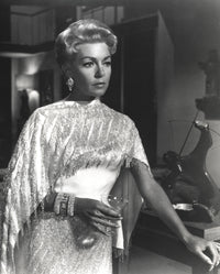 Portrait photo print of Lana Turner holding a wine glass in a white gown.