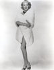 Lana Turner standing in a bathrobe outfit photo print.