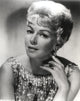 Portrait photo print of Lana Turner wearing a shiny outfit