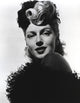 Close-up portrait photo print of Lana Turner in a black gown