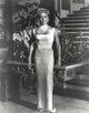 Lana Turner posing in a white long gown photo print