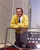 Jerry Van Dyke leaning in yellow coat photo print