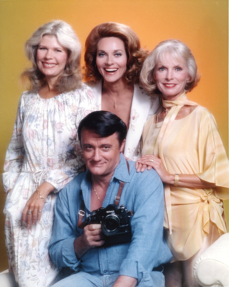 Robert Vaughn Holding a Camera Photo Print with Yellow Background