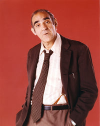 Abe Vigoda in a black suit photo print, showcasing his classic style.