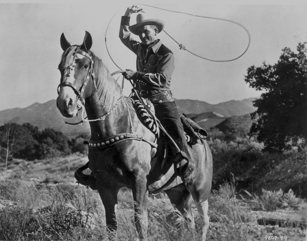 Jimmy Wakely on horseback with lasso photo print