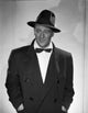 John Wayne in a bowtie coat and hat photo print