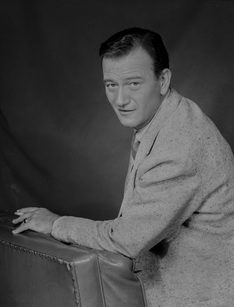 John Wayne leaning on a foam in a suit photo print
