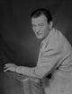 John Wayne leaning on a foam in a suit photo print