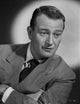John Wayne Photo Print in Suit Crossing Arms