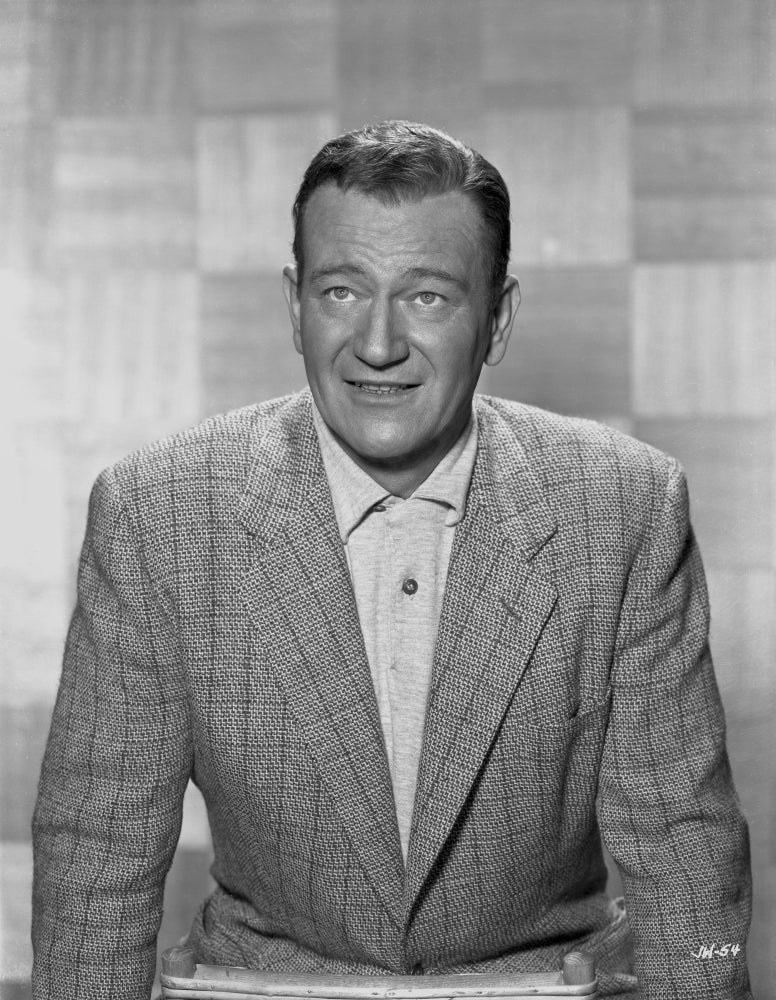 Black and white portrait photo print of John Wayne in a suit.