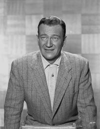 Black and white portrait photo print of John Wayne in a suit.