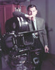Jack Webb Portrait in Black Suit with Camera Photo Print