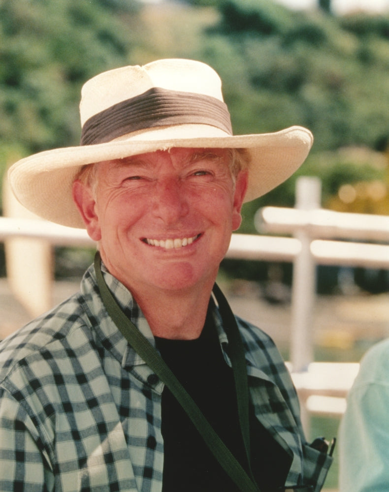 Peter Weir Portrait in White Hat Photo Print showcasing filmmaker style.