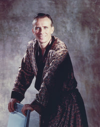 Peter Weller smiling in a gold robe photo print