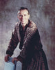 Peter Weller smiling in a gold robe photo print