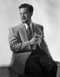 Orson Welles seated in tuxedo photo print, classic cinema art.