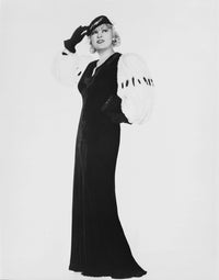 Mae West in a black dress with a white background photo print.