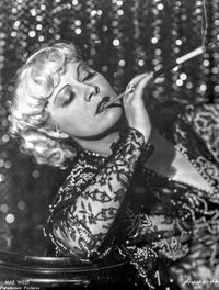 Black and white photo print of Mae West posing elegantly.