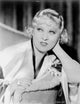 Mae West sitting in a white robe portrait photo print