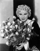 Mae West Holding Flowers in Black and White Dress Photo Print