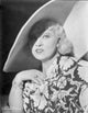 Mae West smiling in elegant black and white dress photo print