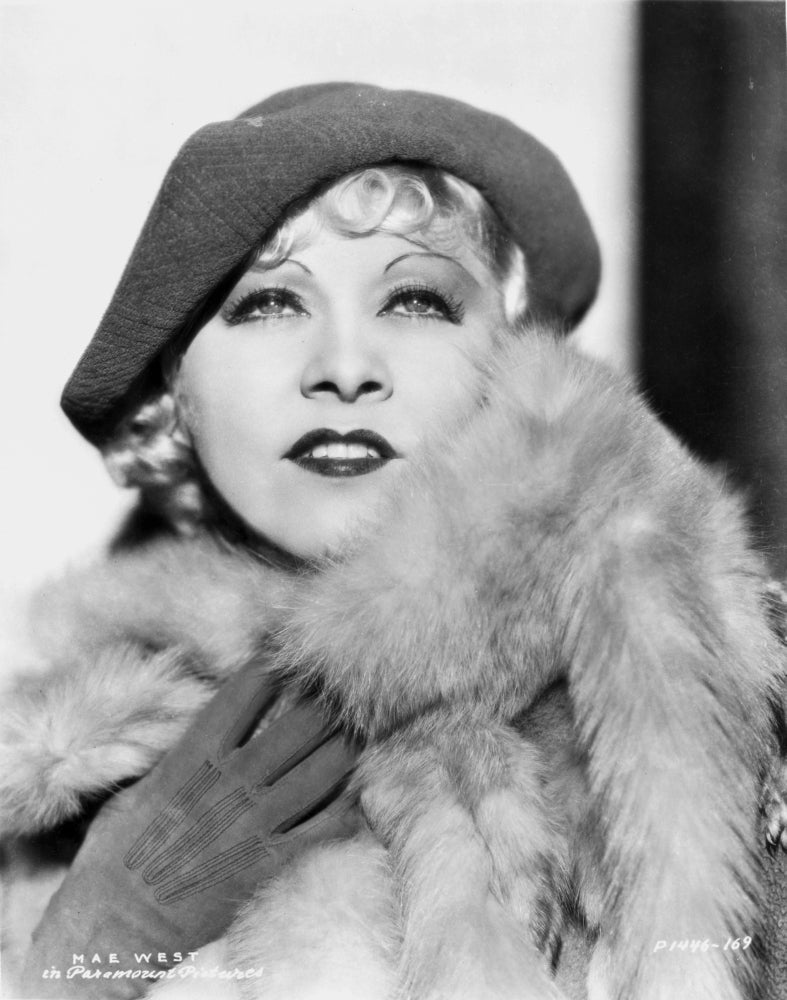 Black and white photo print of Mae West smiling, showcasing her iconic charm.