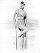 Esther Williams leaning on surfboard in swimsuit photo print