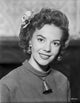 Natalie Wood smiling in a sweater photo print, capturing classic Hollywood charm.