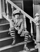 Natalie Wood sitting on the stairs photo print in various sizes.