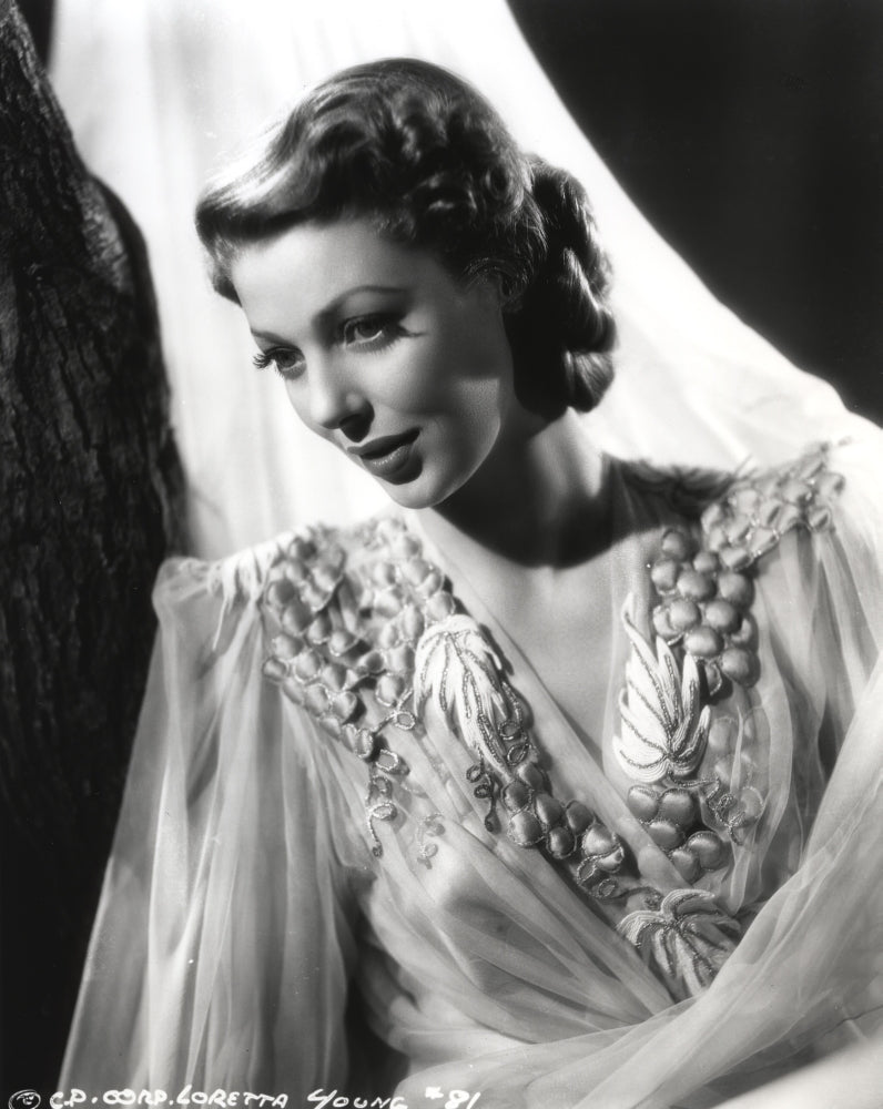 Loretta Young in a crepe white dress with sheer sleeves photo print
