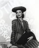 Loretta Young wearing a black striped long sleeve dress suit photo print.