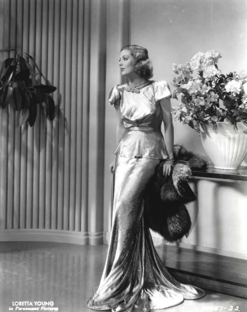 Loretta Young in shiny satin gown black and white photo print.
